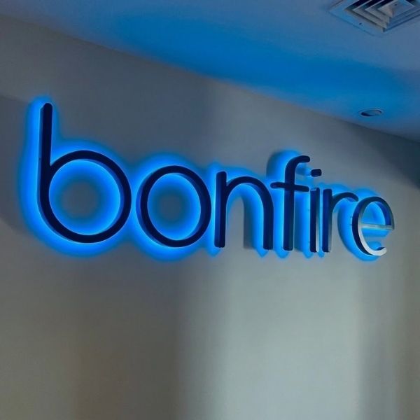 Illuminated Bonfire Wellness sign on wall — anti-inflammatory lifestyle