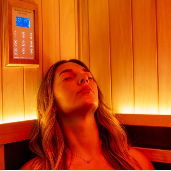 Close-up of a woman relaxing in an IR sauna at Bonfire Wellness.