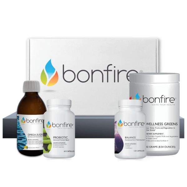 Bonfire Daily Essentials supplement kit featuring Omega-3 Liquid, Probiotic, Balance Multivitamin, and Wellness Greens powder in front of a white Bonfire brand box.